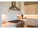 The kitchen shows white herringbone backsplash, stainless vent, and modern cabinetry with gold hardware at 987 Oak Terrace Rd, Westfield, IN 46074