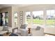 Cozy living room with inviting seating and a picturesque view of the pond, creating a tranquil and comfortable ambiance at 987 Oak Terrace Rd, Westfield, IN 46074