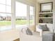A living room features a large bay window with backyard view, and built in shelving at 987 Oak Terrace Rd, Westfield, IN 46074
