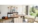 Elegant home office with a classic desk setup, lamps, and scenic views at 987 Oak Terrace Rd, Westfield, IN 46074