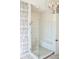 Modern glass shower with subway tile, integrated bench, and elegant lighting fixtures for a luxurious feel at 987 Oak Terrace Rd, Westfield, IN 46074