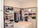 Expansive walk-in closet with island, offering plenty of storage for clothes, shoes, and accessories at 987 Oak Terrace Rd, Westfield, IN 46074