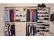 Organized walk-in closet with custom shelving and hanging rods for optimal storage solutions at 987 Oak Terrace Rd, Westfield, IN 46074