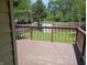 A wooden deck offers a scenic view of the backyard at 1008 E 61St St, Indianapolis, IN 46220