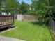 A deck overlooks a well maintained back yard with storage shed at 1008 E 61St St, Indianapolis, IN 46220