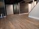 Renovated basement features vinyl floors and partially paneled wall accents at 1008 E 61St St, Indianapolis, IN 46220