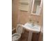 Bathroom with traditional-style fixtures, toilet, and tiled walls at 1008 E 61St St, Indianapolis, IN 46220