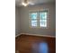 Cozy bedroom showcasing hardwood floors, double windows and gray walls at 1008 E 61St St, Indianapolis, IN 46220