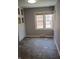 Sunlit breakfast nook showcases tiled floors, white trim, and large double windows at 1008 E 61St St, Indianapolis, IN 46220