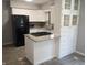 Kitchen featuring white cabinets, granite countertops, and stainless steel appliances at 1008 E 61St St, Indianapolis, IN 46220
