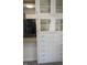 Charming kitchen with white cabinets, glass-front uppers and stainless steel appliances at 1008 E 61St St, Indianapolis, IN 46220