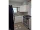Well-lit kitchen features granite countertops, stainless steel range, and neutral tile flooring at 1008 E 61St St, Indianapolis, IN 46220