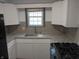 Eat in kitchen with granite countertops and stainless steel appliances at 1008 E 61St St, Indianapolis, IN 46220
