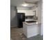 Kitchen featuring white cabinets, granite countertops, and stainless steel appliances at 1008 E 61St St, Indianapolis, IN 46220