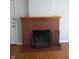 Living room featuring a classic brick fireplace and hardwood floors at 1008 E 61St St, Indianapolis, IN 46220