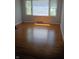 Bright living room featuring large windows and beautiful hardwood floors at 1008 E 61St St, Indianapolis, IN 46220