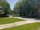 A charming street view showcases the neighborhood with lush trees and sidewalks at 1008 E 61St St, Indianapolis, IN 46220