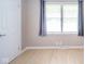 Inviting bedroom with ample natural light, wooden floors and white trim at 10097 N Balfer E Dr, Fortville, IN 46040