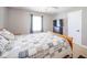 Bright bedroom with ceiling fan, side tables and windows, offering comfort at 10097 N Balfer E Dr, Fortville, IN 46040