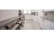 Modern kitchen featuring white cabinets, stainless steel appliances, granite countertops, and a built in bar at 10097 N Balfer E Dr, Fortville, IN 46040
