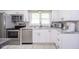 Modern kitchen featuring white cabinets, stainless steel appliances, and granite countertops at 10097 N Balfer E Dr, Fortville, IN 46040