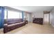 Bright living room with hardwood floors, comfortable seating, and plenty of natural light at 10097 N Balfer E Dr, Fortville, IN 46040