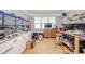 Spacious work area featuring custom storage, bright windows, and an organized layout at 10097 N Balfer E Dr, Fortville, IN 46040