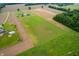 Aerial view of the farm showing both the main residence with a pool, and a second residence with the outbuilding at 10274 S 400 W, Pendleton, IN 46064