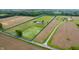Stunning aerial view of property, featuring a home, outbuilding, and expansive green space with a clearly marked boundary at 10274 S 400 W, Pendleton, IN 46064