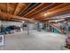 Unfinished basement with exposed wooden beams, concrete walls and floor, and visible utilities at 10274 S 400 W, Pendleton, IN 46064