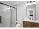 Contemporary bathroom with a glass-enclosed shower, a wooden vanity, and modern fixtures at 10274 S 400 W, Pendleton, IN 46064