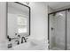 Elegant bathroom featuring a modern vanity with a black faucet and a glass-enclosed shower at 10274 S 400 W, Pendleton, IN 46064
