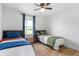 Shared bedroom featuring two beds with blue accents and a bright window with natural light at 10274 S 400 W, Pendleton, IN 46064