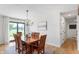 Cozy dining room with a wooden table, chandelier, and sliding glass doors to the outside at 10274 S 400 W, Pendleton, IN 46064