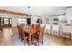 Charming dining room with a wooden table, chandelier, and open access to the kitchen at 10274 S 400 W, Pendleton, IN 46064