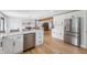 Modern kitchen featuring white cabinets, stainless steel appliances, and a breakfast bar at 10274 S 400 W, Pendleton, IN 46064