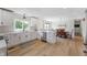 Well-lit kitchen with white cabinets, stainless steel appliances, and a view to the dining area at 10274 S 400 W, Pendleton, IN 46064