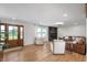 Bright living room with wood floors, a brick fireplace, and comfortable seating at 10274 S 400 W, Pendleton, IN 46064