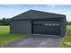 View of the modern outbuilding with a large garage door and dark siding at 10274 S 400 W, Pendleton, IN 46064