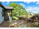 Lovely wooden back deck and screened porch overlooks a serene pond and mature landscaping at 10560 Lighthouse Way, Indianapolis, IN 46256