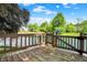 The back deck features beautiful views of the pond and mature trees at 10560 Lighthouse Way, Indianapolis, IN 46256