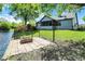 Beautiful backyard including a pond, firepit, and lush green lawn at 10560 Lighthouse Way, Indianapolis, IN 46256
