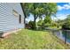 Fenced backyard and lake access from the side of the home at 10560 Lighthouse Way, Indianapolis, IN 46256