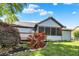 View of the backyard, wooden deck, and screened-in porch on a sunny day at 10560 Lighthouse Way, Indianapolis, IN 46256
