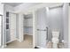 Bathroom with a toilet, closet, and custom built-in shelving at 10560 Lighthouse Way, Indianapolis, IN 46256