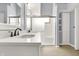 Bathroom with double vanity, a frameless shower, and built-in storage at 10560 Lighthouse Way, Indianapolis, IN 46256