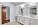 Bathroom featuring a double vanity with a white countertop and modern fixtures at 10560 Lighthouse Way, Indianapolis, IN 46256