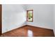 Bright bedroom with hardwood floors, window with blinds and neutral walls at 10560 Lighthouse Way, Indianapolis, IN 46256
