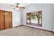 Carpeted bedroom featuring a bay window and closet with sliding doors at 10560 Lighthouse Way, Indianapolis, IN 46256