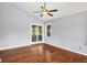 Bright bedroom featuring hardwood floors and slider to the backyard at 10560 Lighthouse Way, Indianapolis, IN 46256